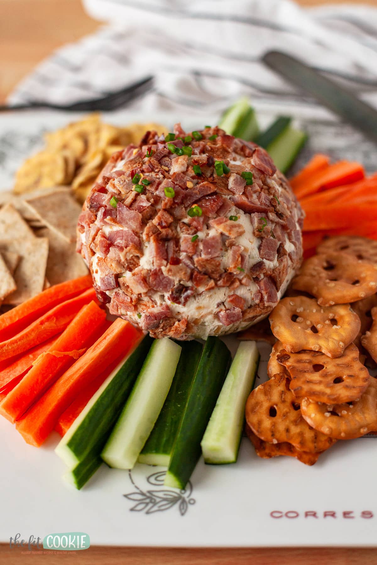 close up photo of a cheese ball covered with chopped bacon