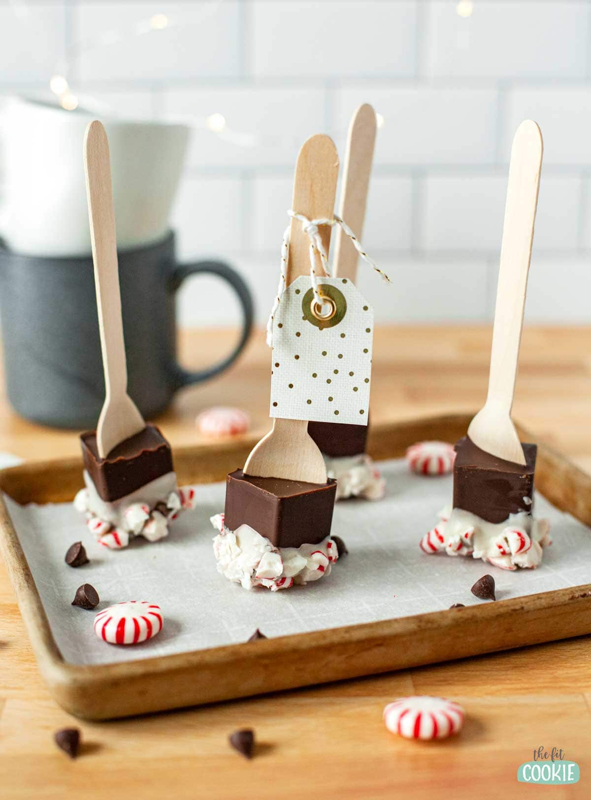 hot cocoa spoons with peppermint and a gift tag