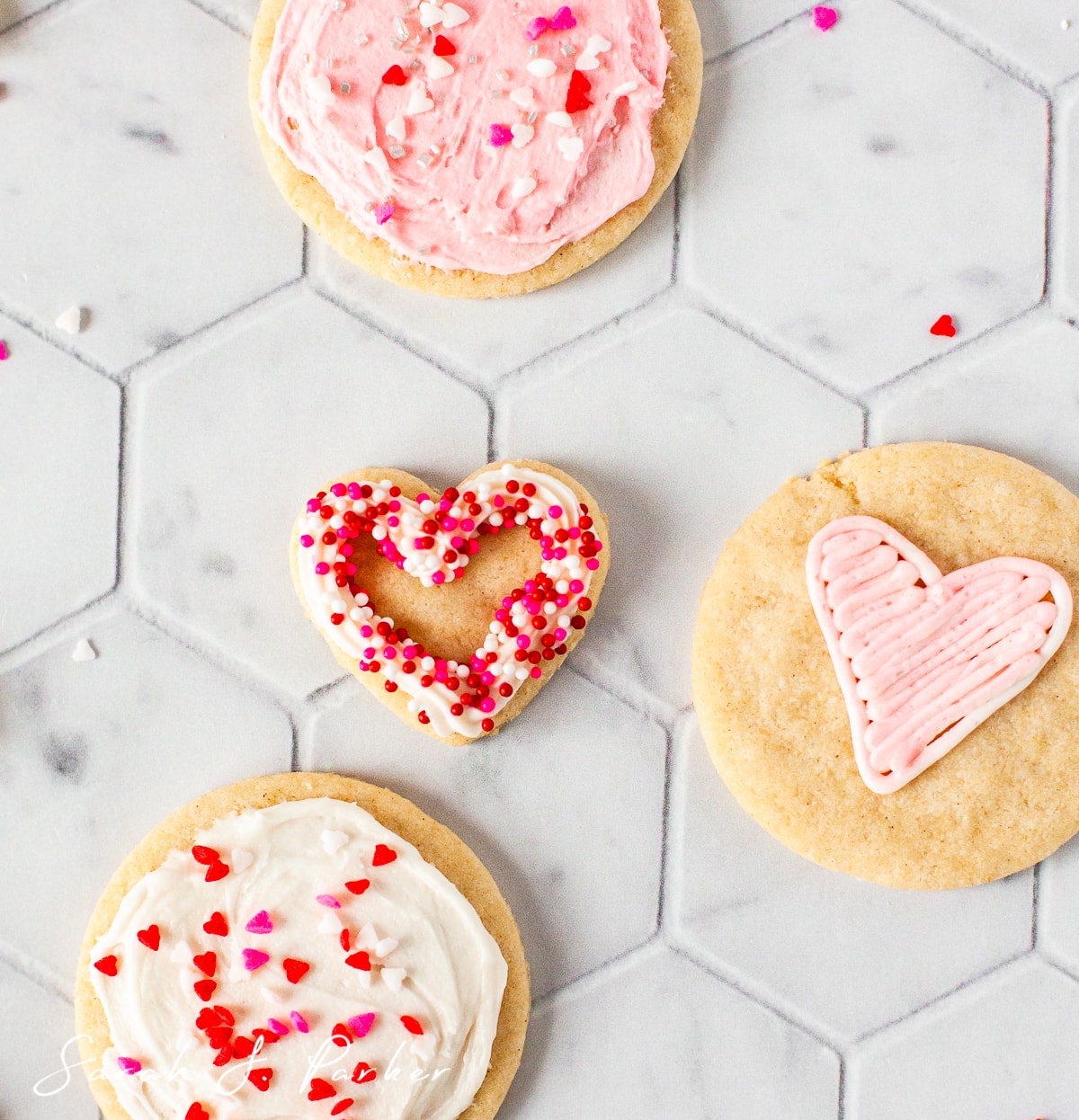 overhead photo of gluten free sugar cookies decorated for valentines day