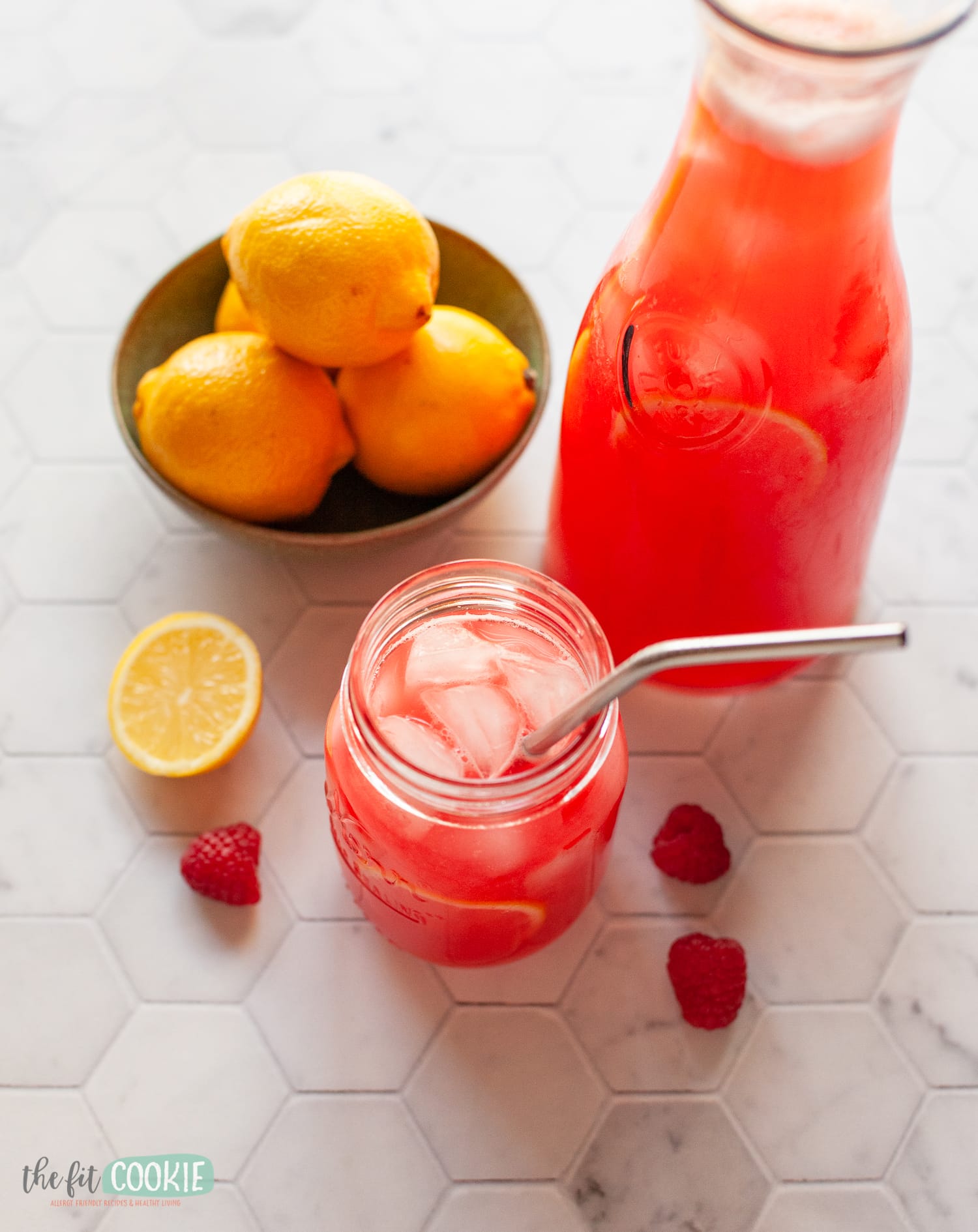 overhead photo of glass filled with raspberry lemonade. 