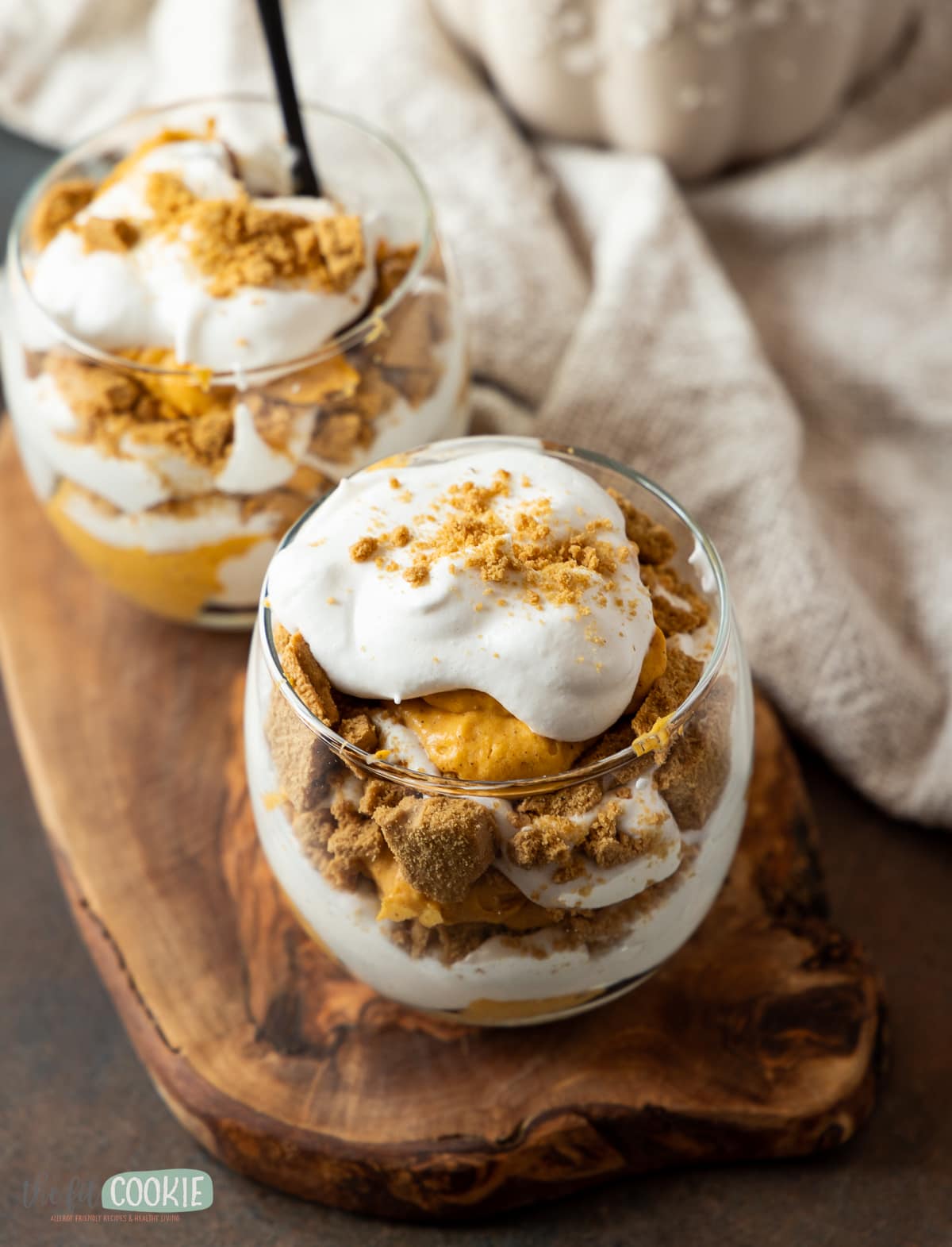 dairy free pumpkin cheesecake trifle in a glass cup. 