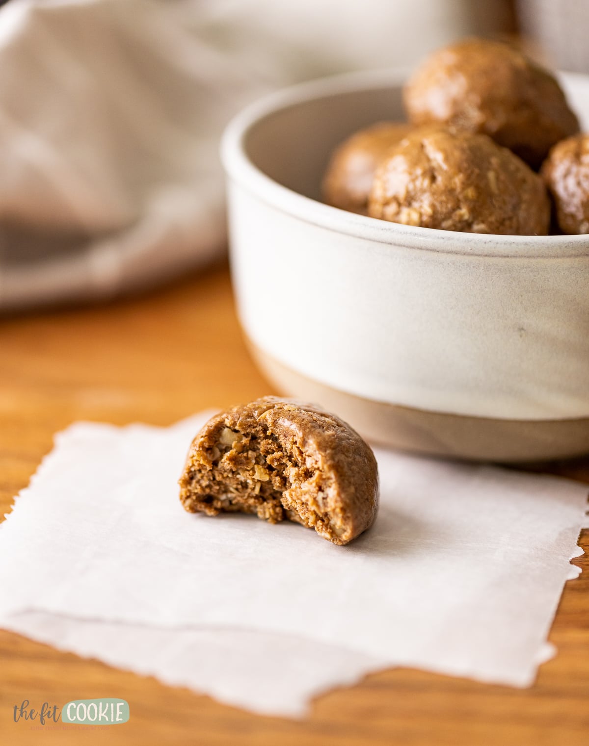 close up photo of a mocha protein ball with a bite taken.