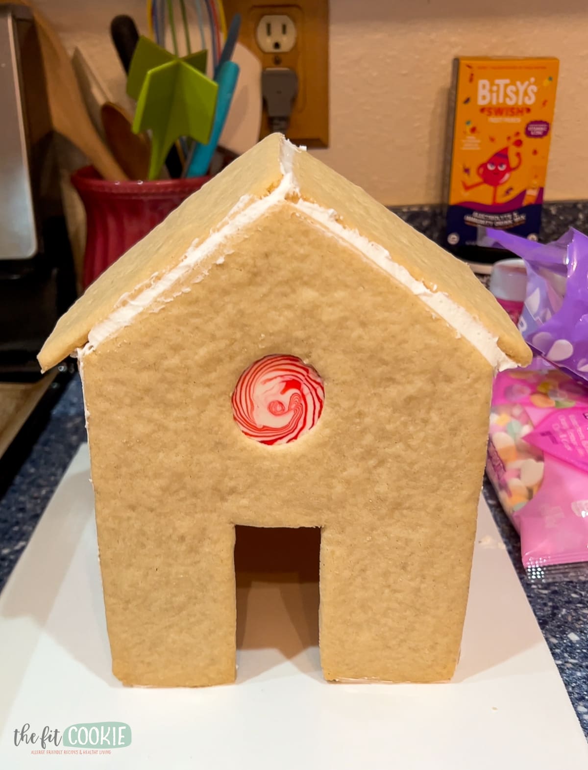 photo of undecorated sugar cookie house with starlight mint window. 