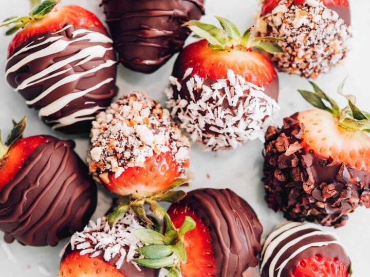 Valentine's Day inspired chocolate covered strawberries on a white background.