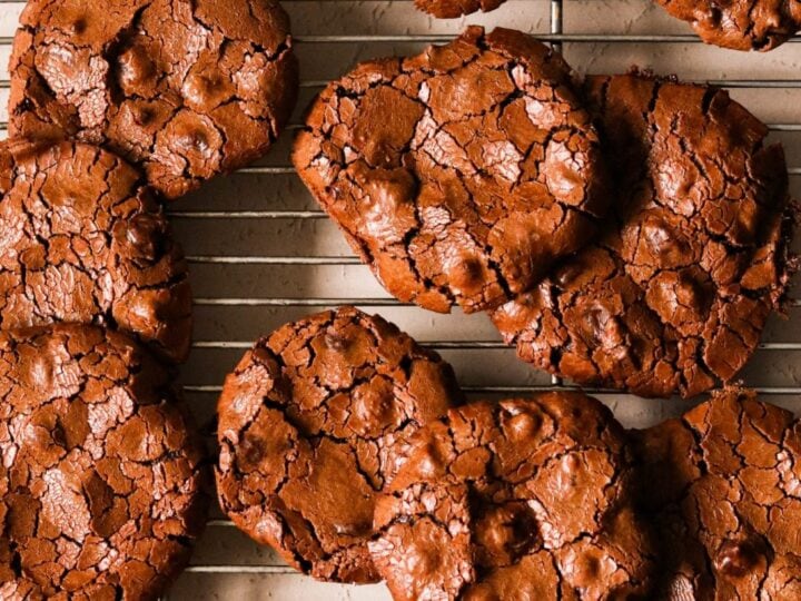 Chocolate cookies on a cooling rack.