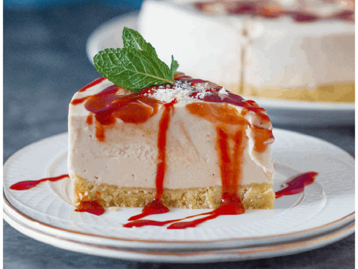 A slice of strawberry cheesecake on a plate.