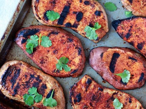 Grilled sweet potato patties on a baking sheet.