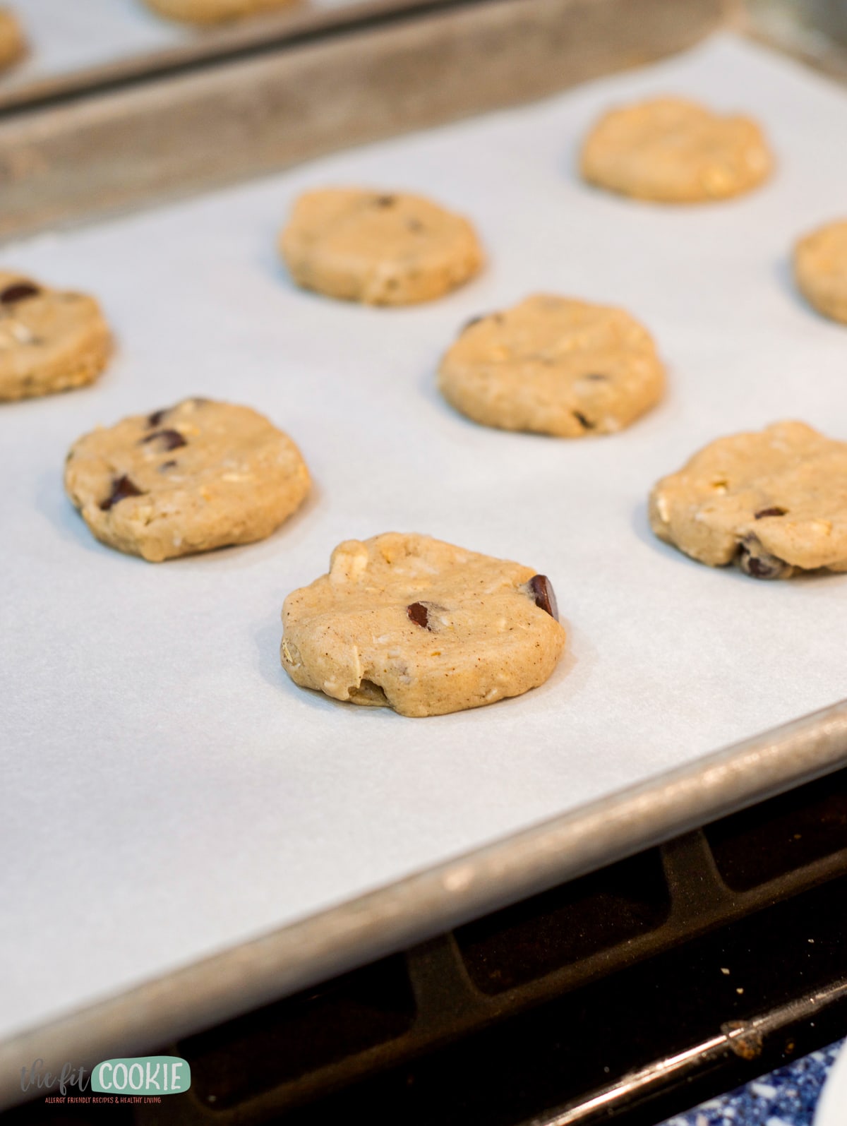 Chocolate chip cowboy cookie dough on a baking sheet.