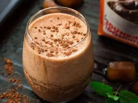 A glass of chocolate mint smoothie on a tray.