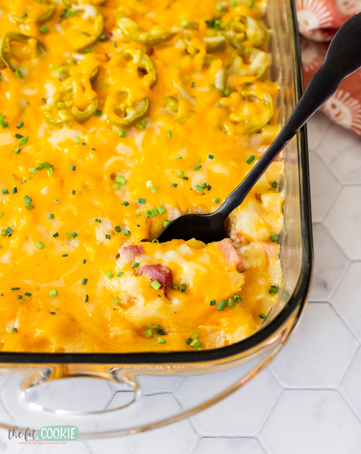 A cheesy dairy free and gluten free casserole dish with ham and jalapenos.