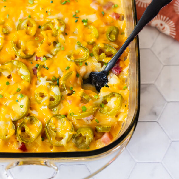 A dairy-free casserole dish filled with cheesy potatoes.