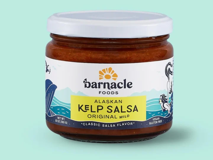 A jar of kelp salsa, perfect for foodies, on a vibrant green background.