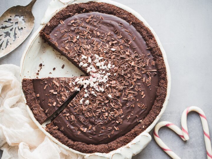 A chocolate pie with a slice taken out.
