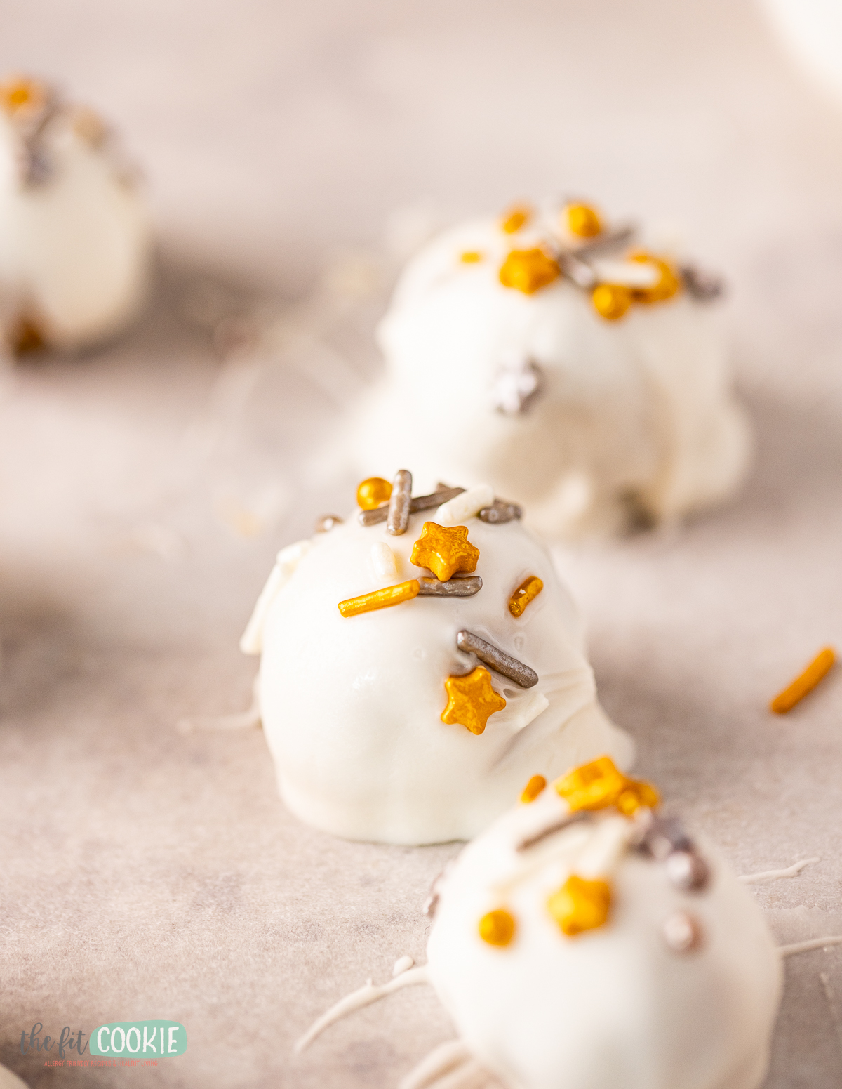 Gingerbread Oreo truffles with dairy free white chocolate and holiday sprinkles.
