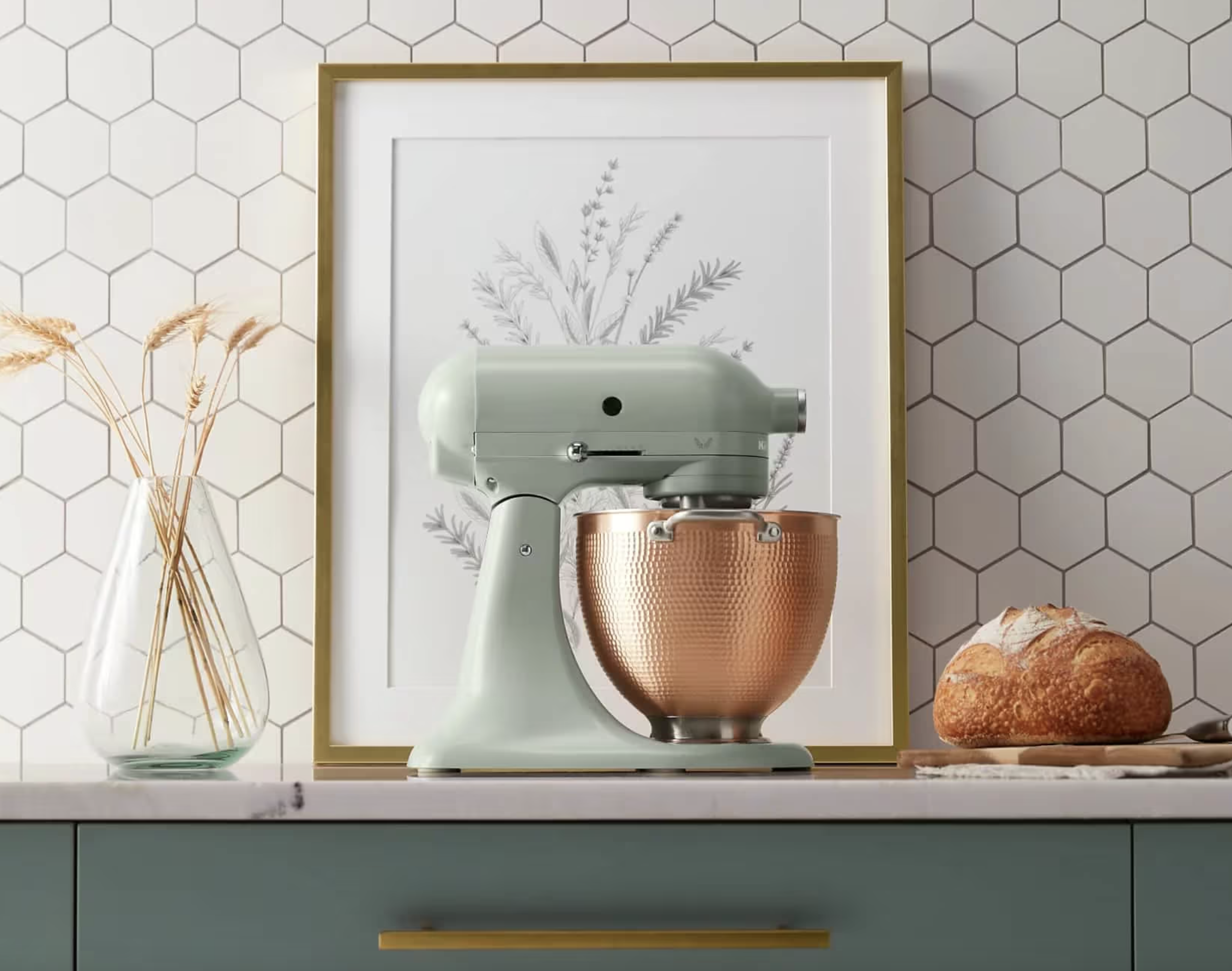 A kitchen with a mixer and bread on the counter, perfect for gifts for foodies.