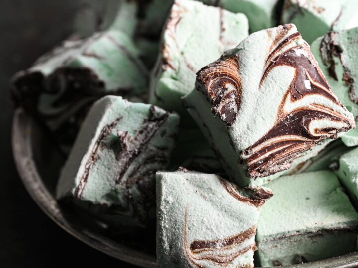 Mint chocolate marshmallows on a plate.