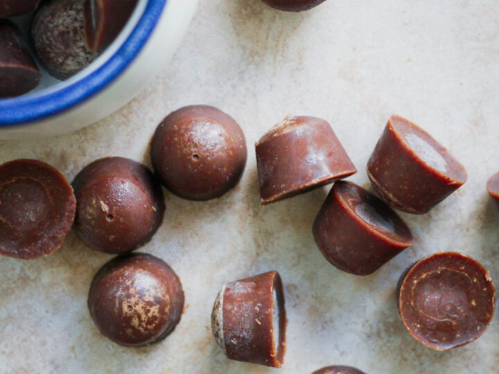Chocolate truffles in a bowl on a table.