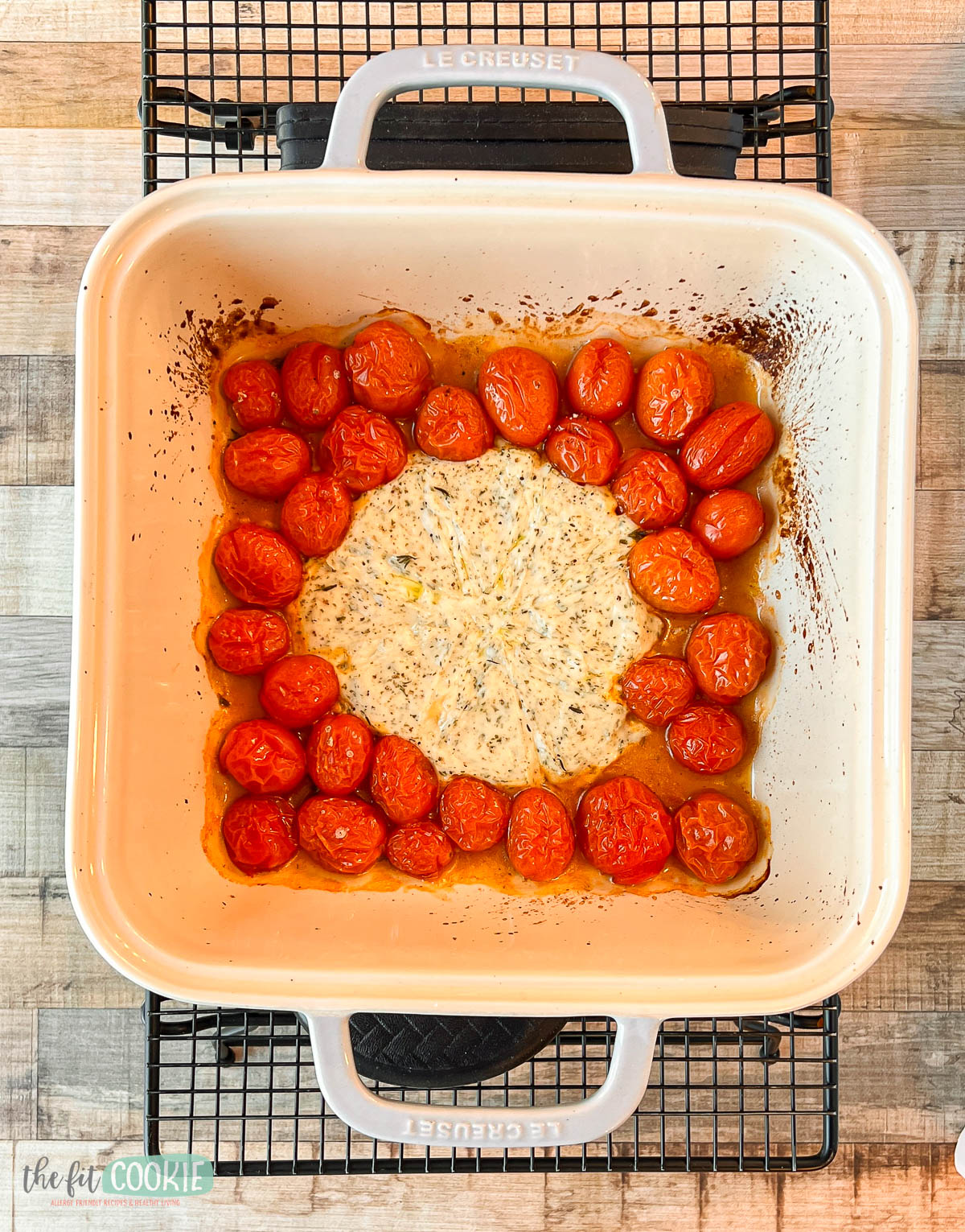 Baked laughing cow plant based cheese with tomatoes.