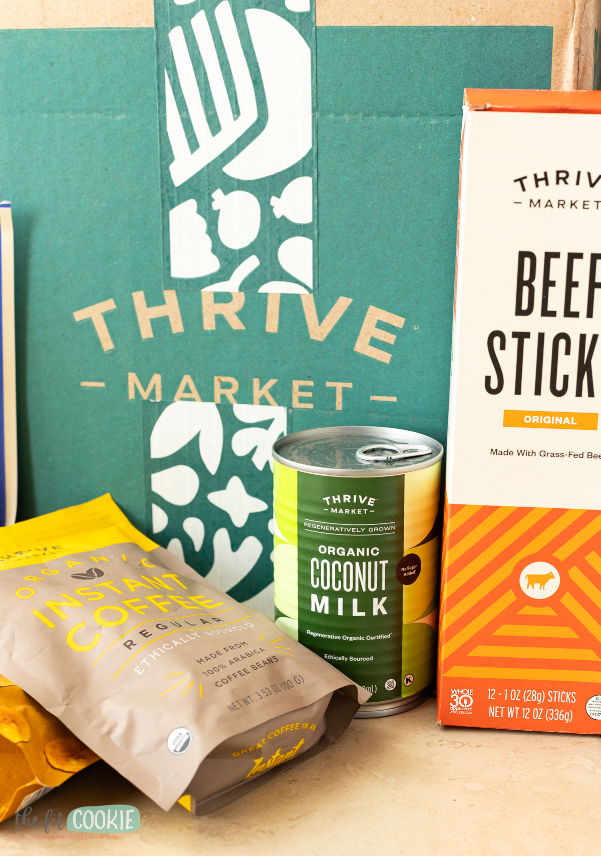 photo of thrive market branded food products in front of a thrive market box. 