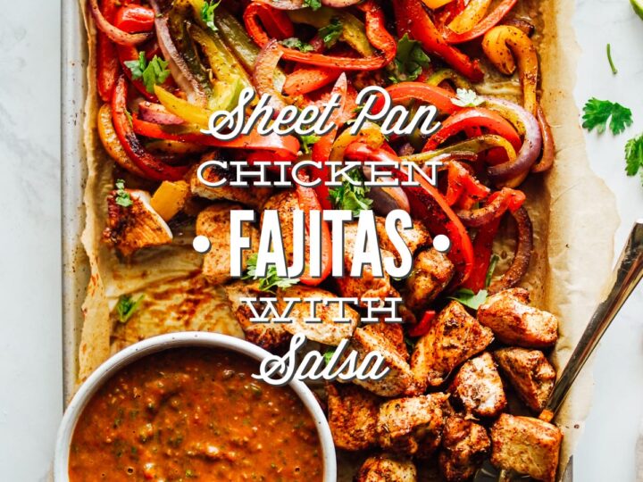 Chicken fajitas with salsa on a baking sheet.