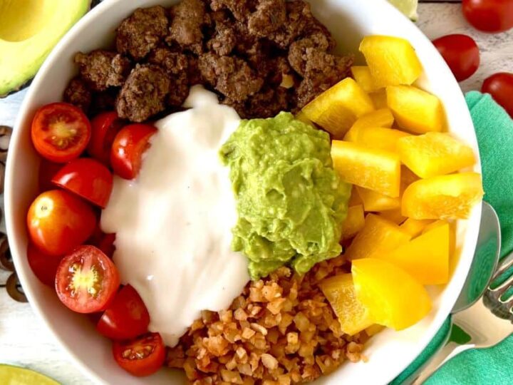Mexican bowl with avocado, tomatoes, and guacamole.