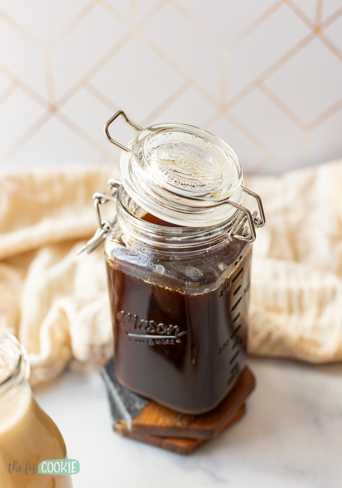 A jar of homemade chai syrup in a jar.
