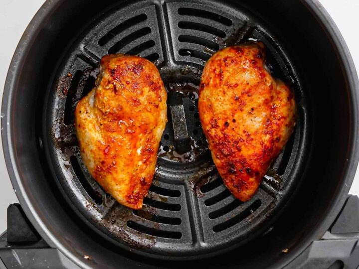 Chicken breasts in an air fryer.