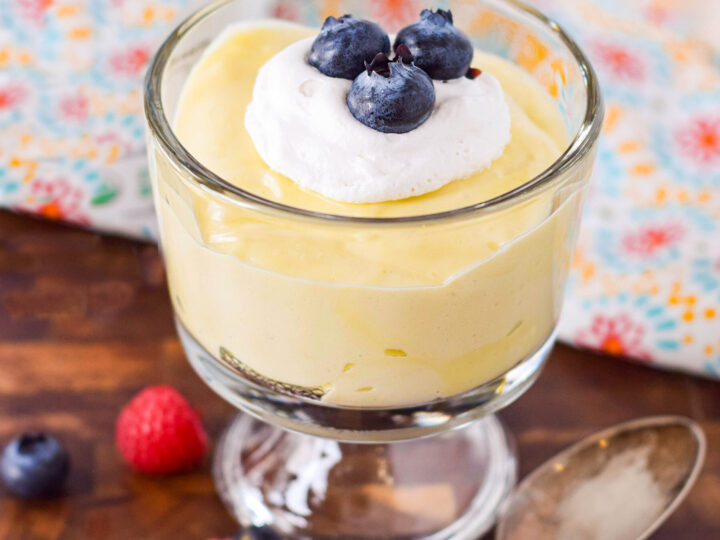 A vegan dessert in a glass with berries.