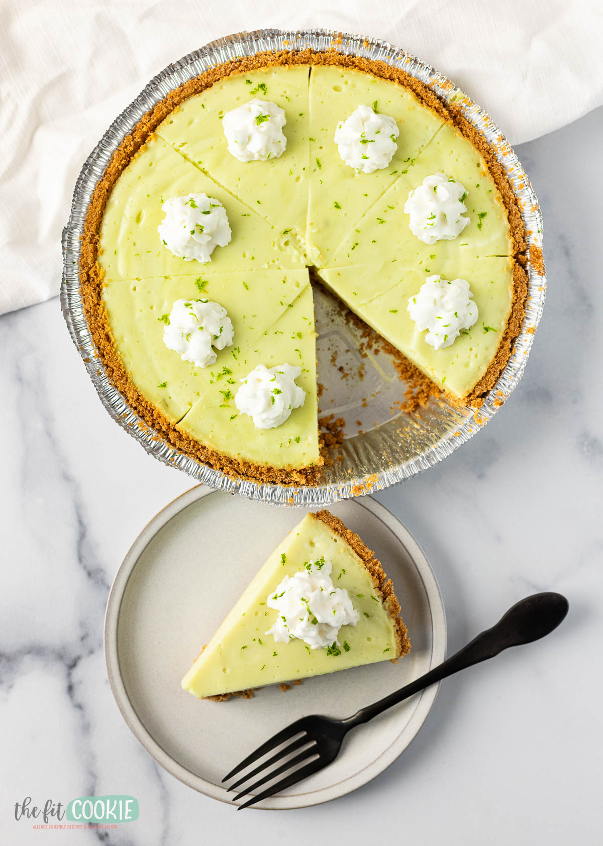 overhead photo of vegan key lime pie with a slice removed. 