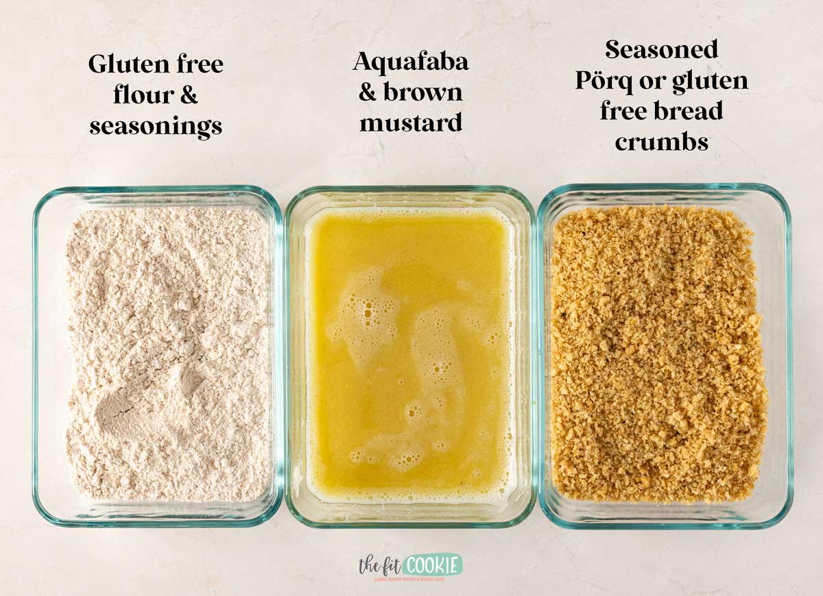 Three glass containers labeled above each, holding gluten free flour and seasonings, aquafaba mixed with brown mustard, and seasoned gluten free bread crumbs.
