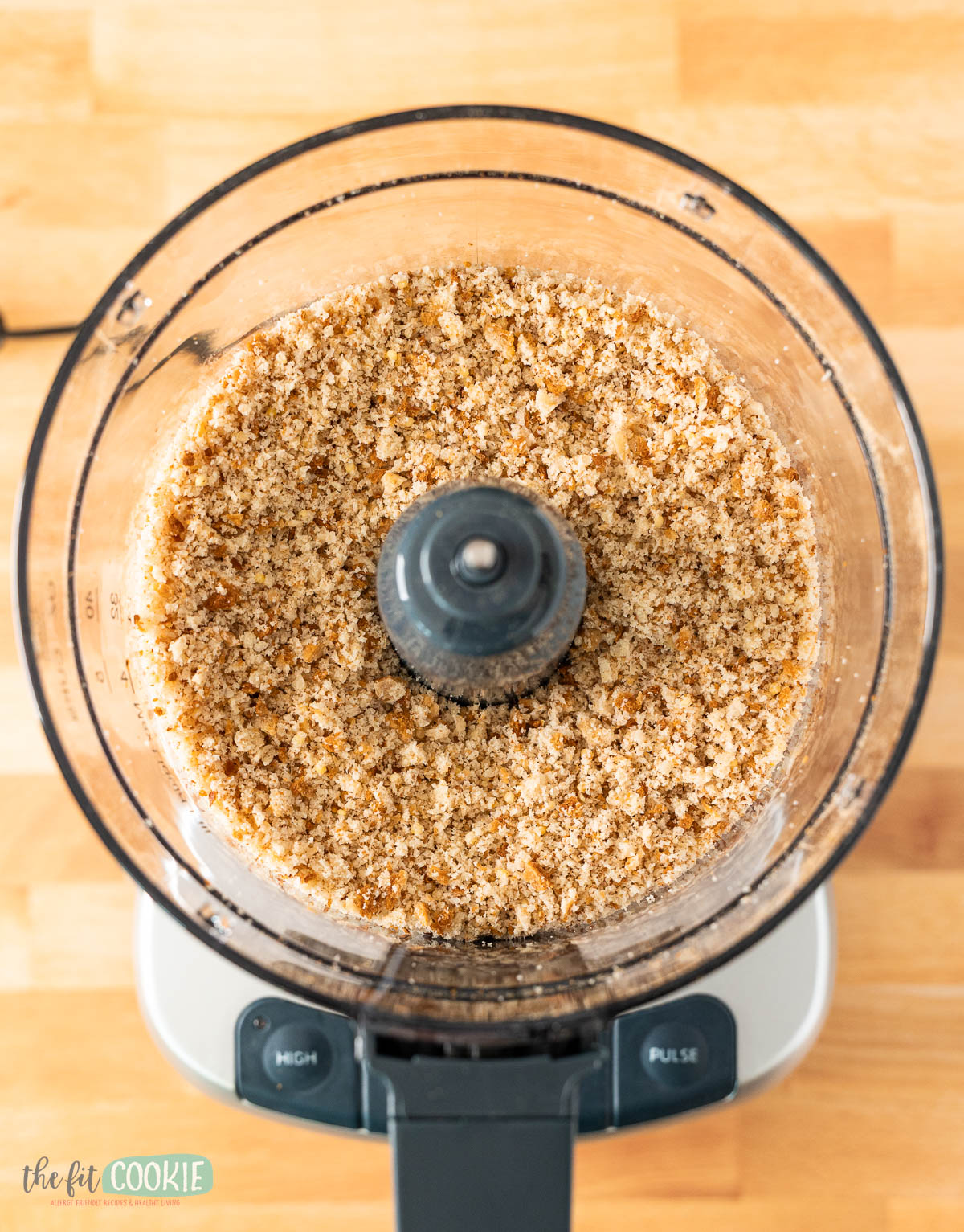 A food processor filled with gluten free bread crumbs.